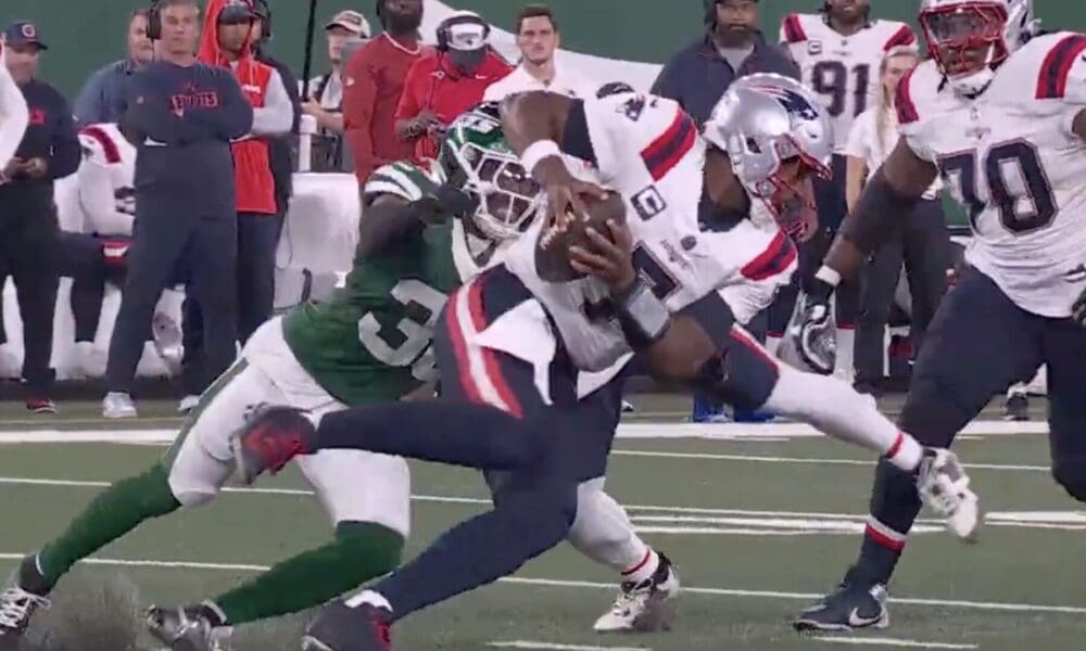 New England Patriots quarterbacks gets sacked on Thursday Night Football against the New York Jets